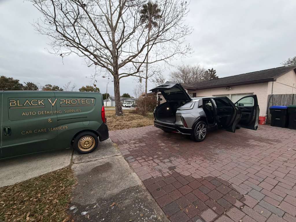 Mobile auto detailing in Orlando, FL · Cadillac Escalade foam wash at customer home · pricing page